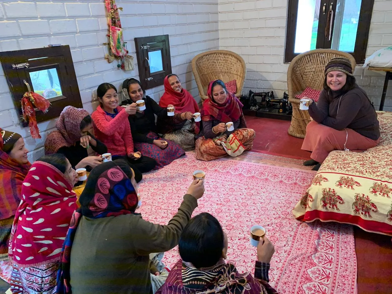 Shefali Chopra telling stories to a circle of women over cups of chai