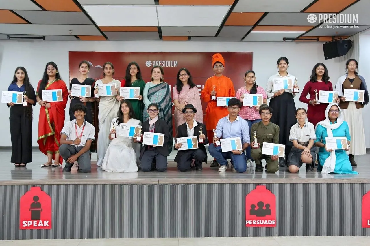 Shefali Chopra on stage with a group of students holding certificates
